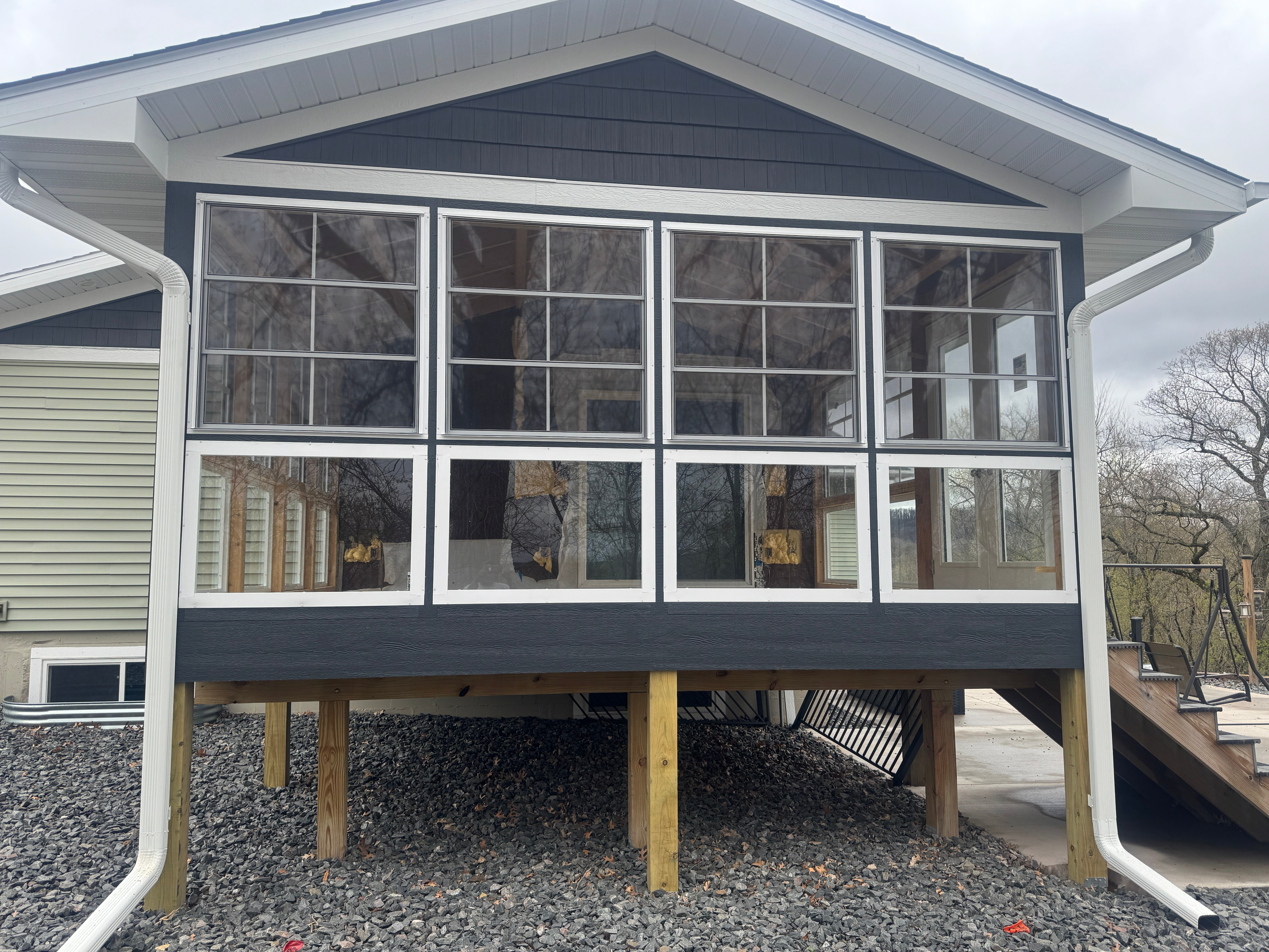 3 panel elevated with fixed glass below and Center bars